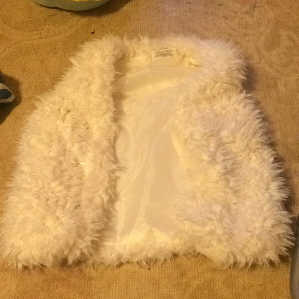 White fuzzy vest